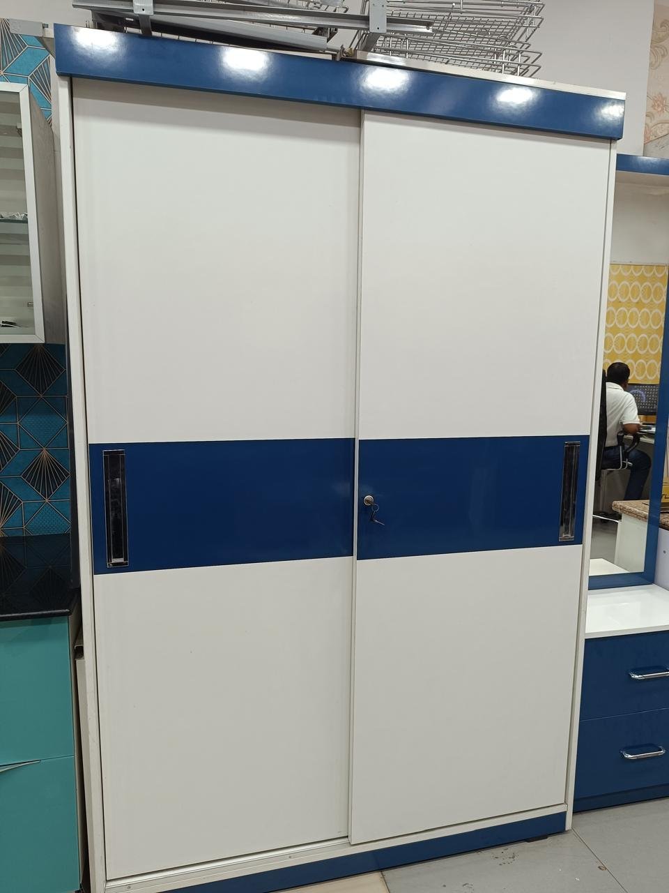 Two-door sliding wardrobe in white and blue laminate